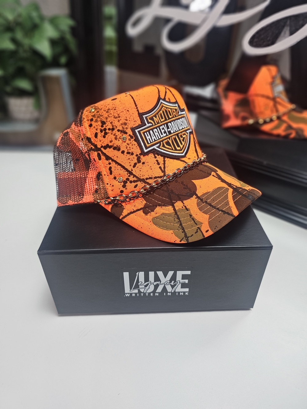 Custom Orange Camo Trucker Hat with Chain Accent
